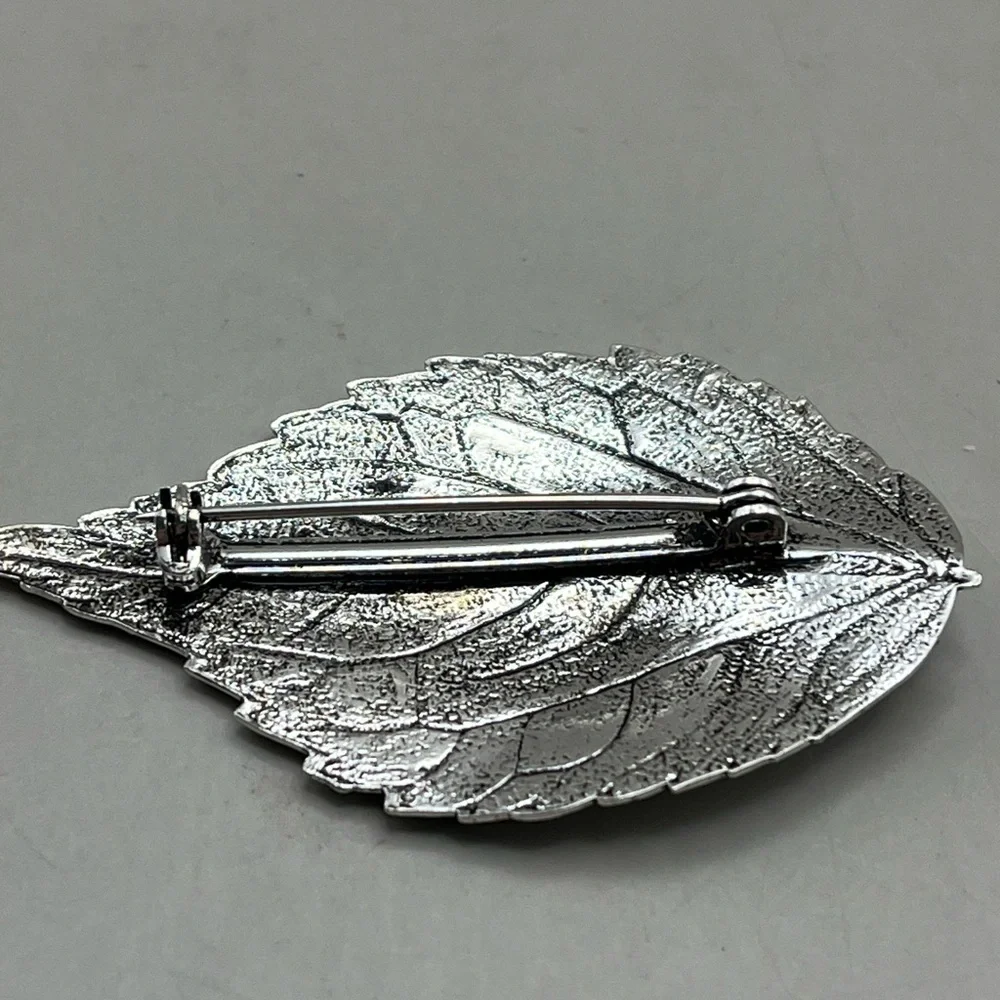 Silver Leaf Brooch with Green Gem